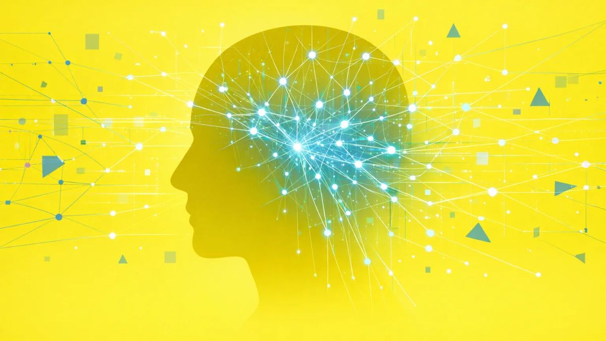 옆얼굴 실루엣에서 빛나는 신경 경로가 두개골 밖으로 뻗어 나가 인디고·코발트 톤의 노드 망과 데이터 흐름에 연결되는 기하학적 추상 이미지. 확장된 마음 이론을 시각화.