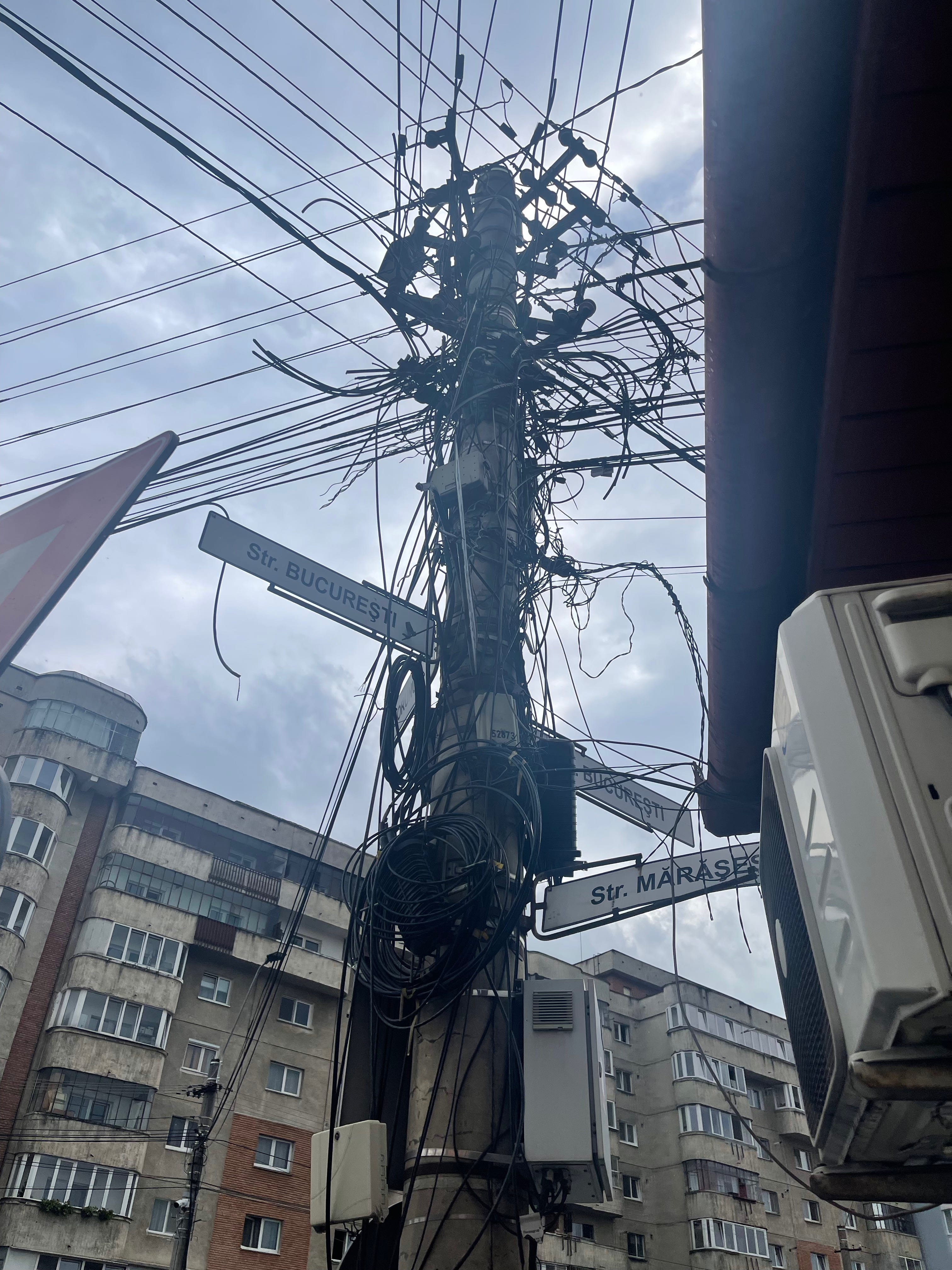 Photo of a tangle of phone wires in Cluj-Napoca, Romania.