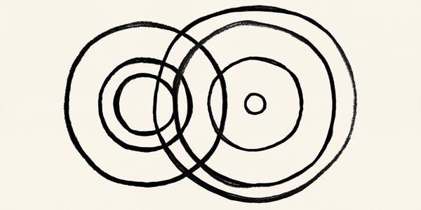 Overlapping black concentric circles that resemble ripples in a pool of wat