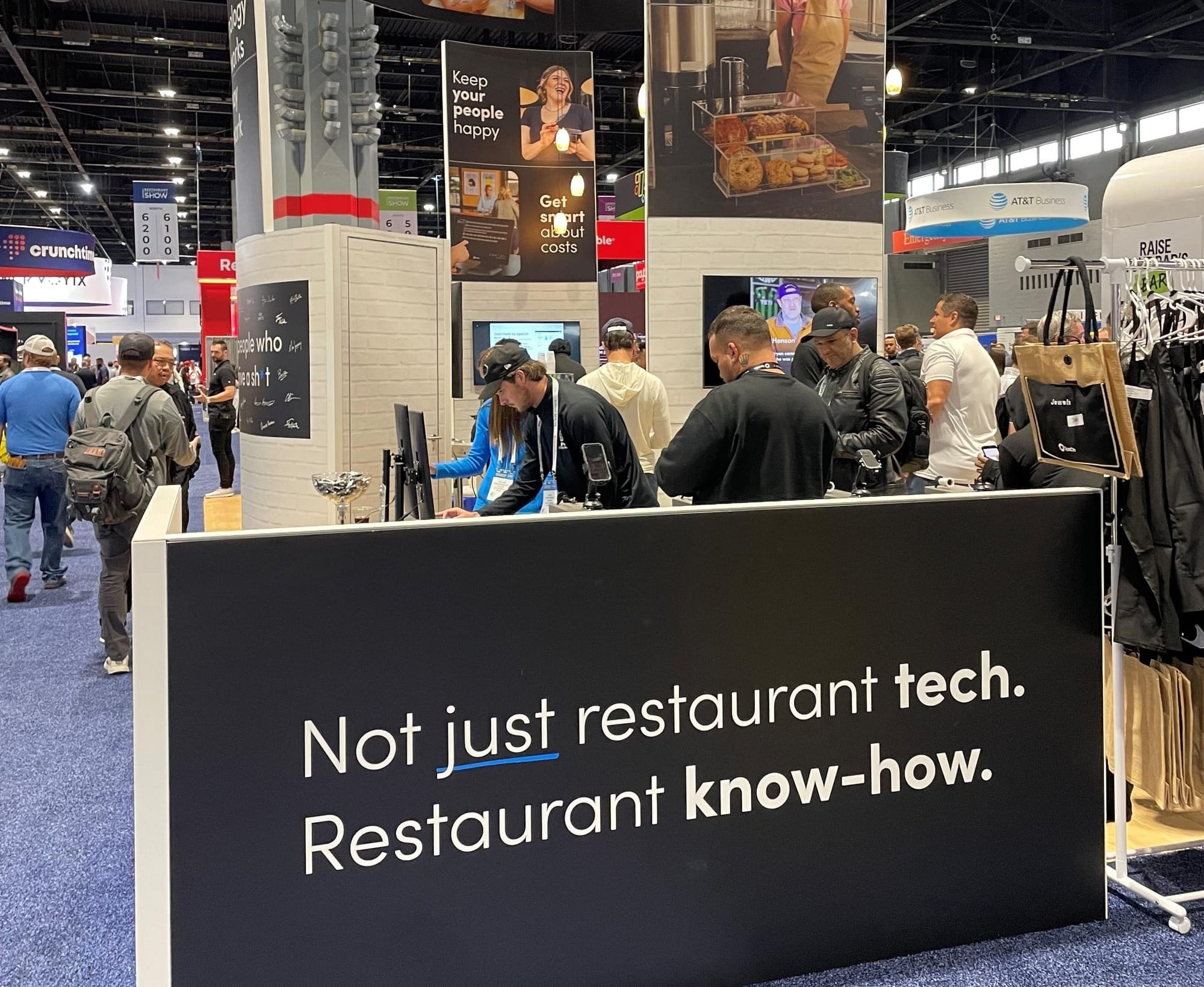 Bryan Solar, SpotOn CPO, speaking with people at the SpotOn Booth at the National Restaurant Association Show 2025