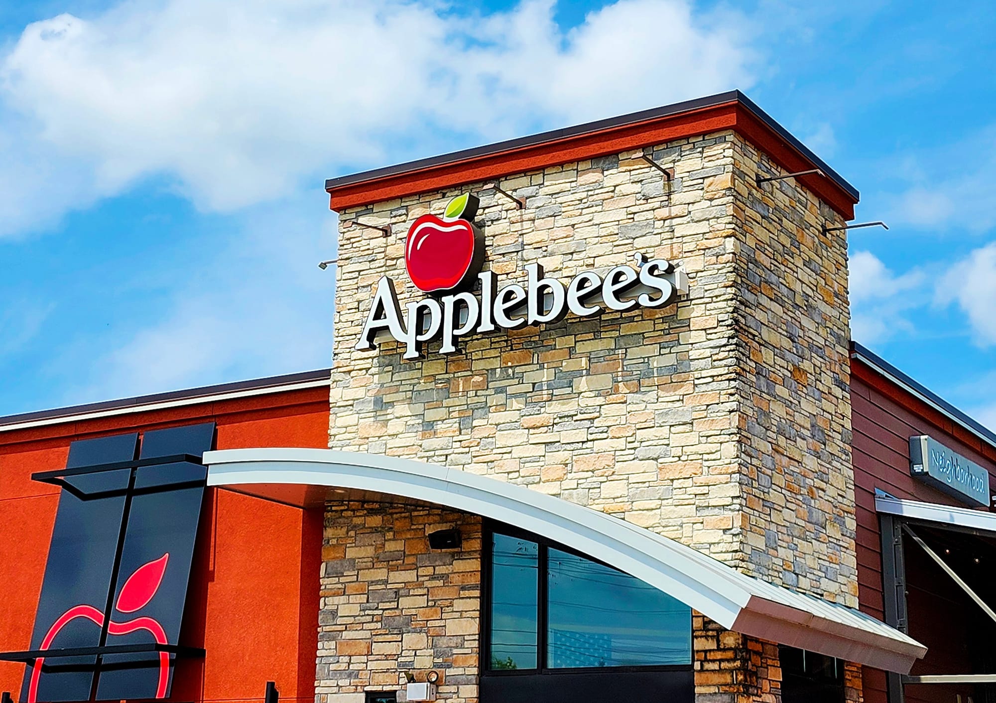Exterior sign displaying the Applebee’s restaurant logo