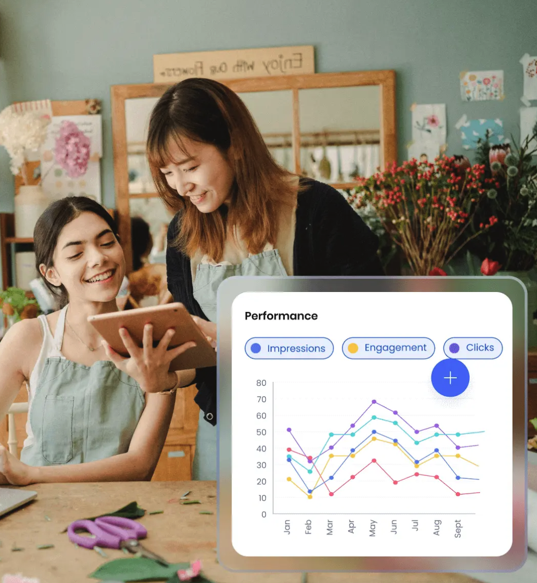 A business owner reviews their performance statistics from the SpotOn Marketing dashboard with an employee.