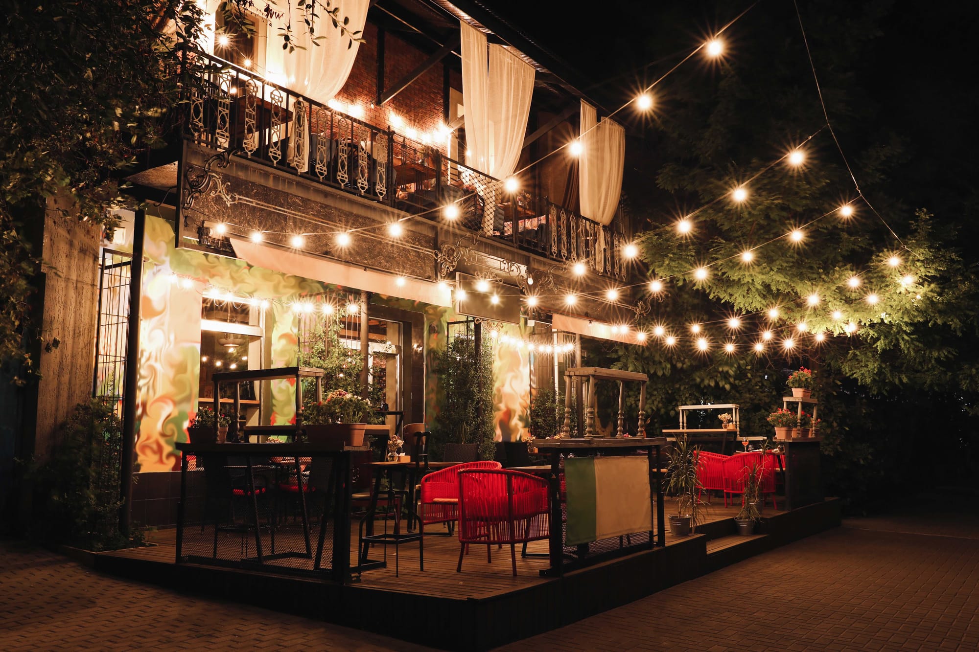 restaurant patio with string lights creating warm evening ambiance