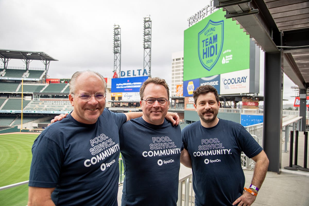 SpotOn Chief Marketing Officer Kevin Bryla, Restaurateur-in-Residence Scott Youkilis, and Area Sales Manager Don Pirone break from volunteering on passing out gift bags at the pre-event Family Meal.