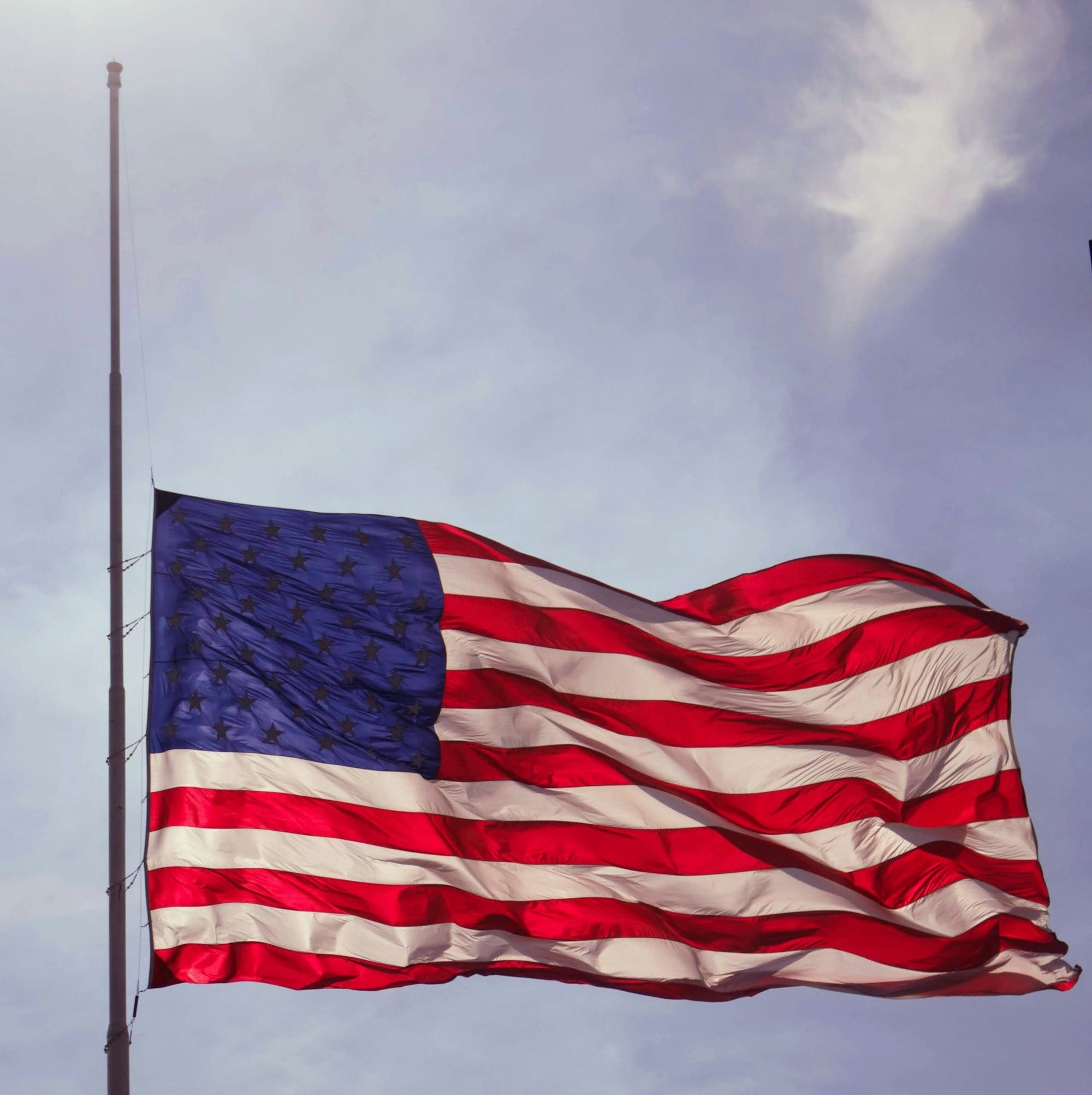 U.S. flag under blue skies