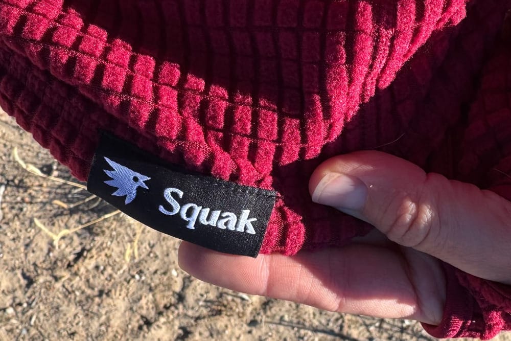 the logo and a close up on the squak grid fleece hoodie