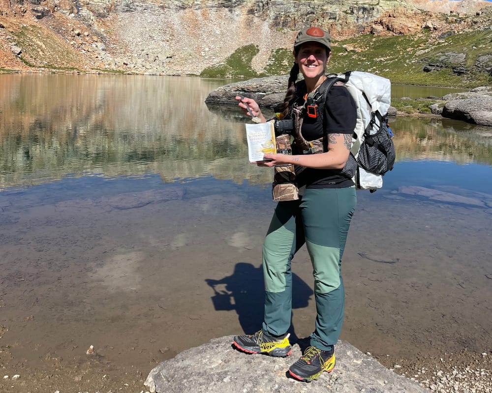 Hyperlite Mountain Gear Southwest 70 Backpack on a backpacker at backcountry campsite.
