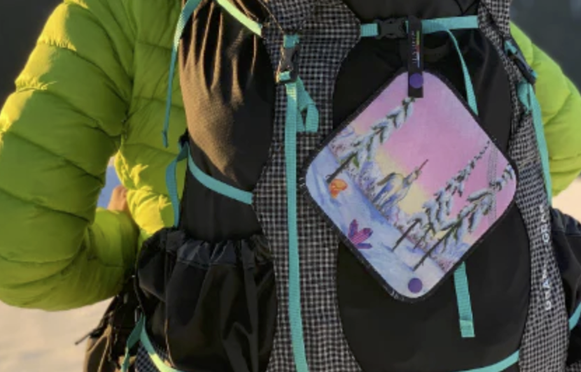 kula pee cloth on a backpack for hiking