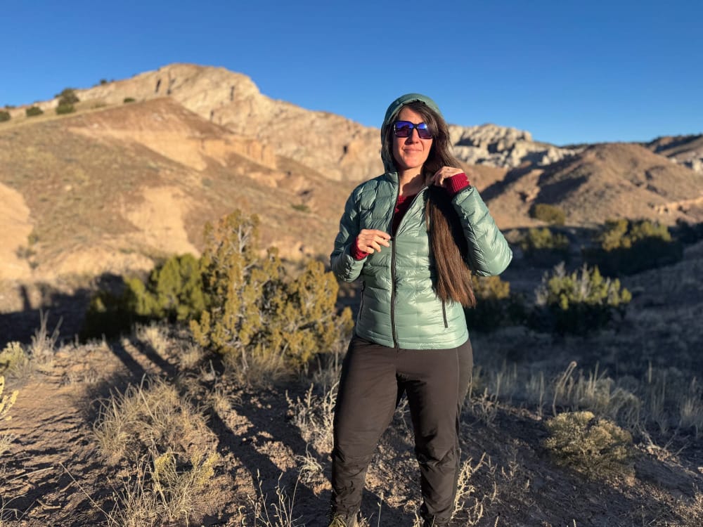 a 2025 hiker wears the novapro down jacket by outdoor vitals in the high desert of the american southwest on a very cold morning