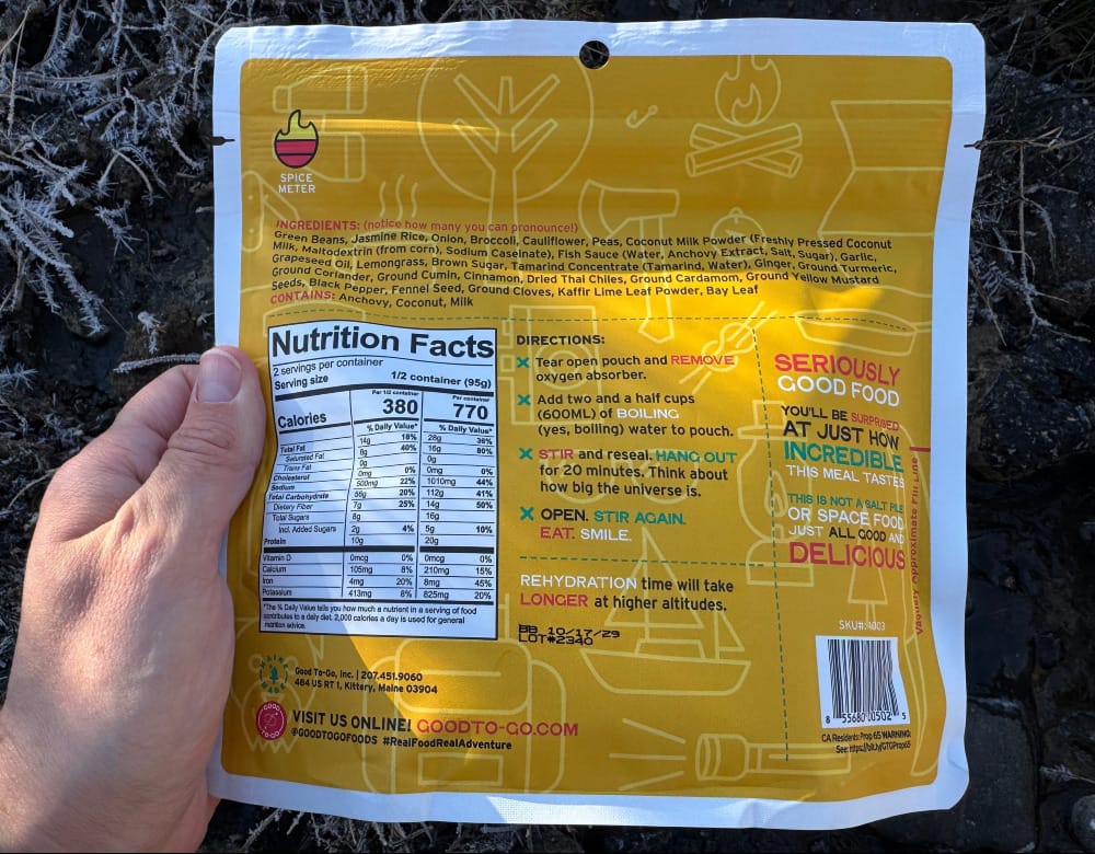 the back of a good to-go dehydrated meal held by a hiker on an adventure