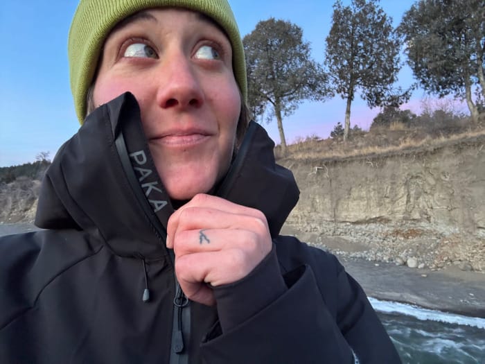 a hiker wears the apu parka with pakafill by paka on a cold weather adventure