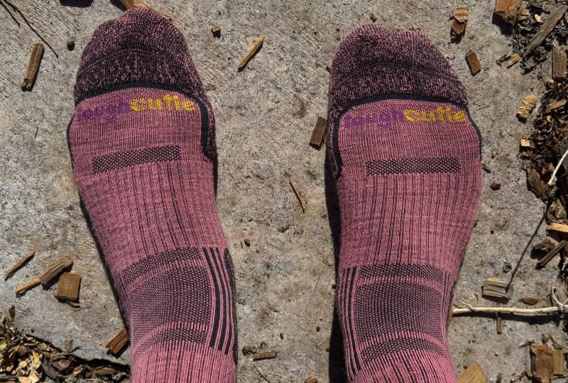 a hiker wears Ladies Light Weight Merino Wool Hiker Crew By ToughCutie outside