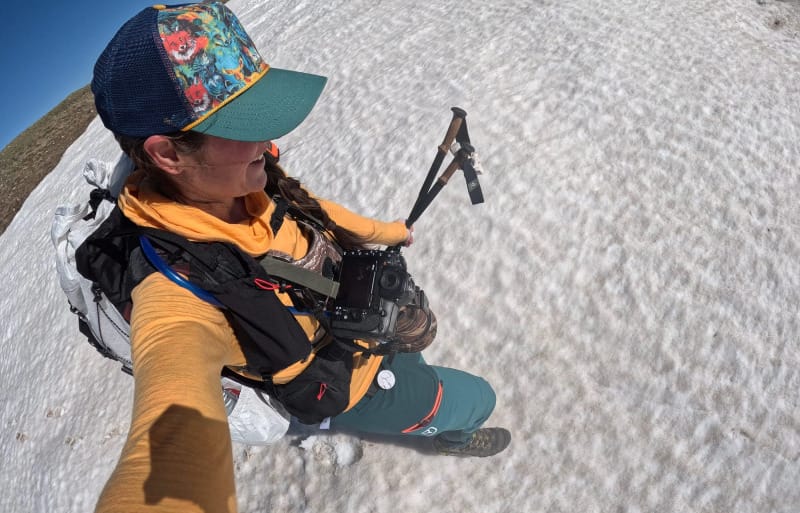 a woman wears the on sale cs40 ultra backpack on a hiking trip in the mountains