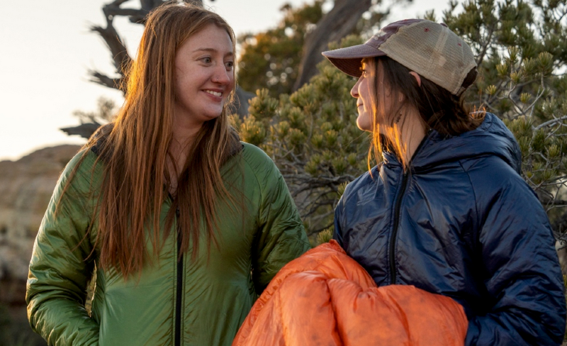two backpackers using custom enlightened equipment gear on a backpacking trip in the mountains