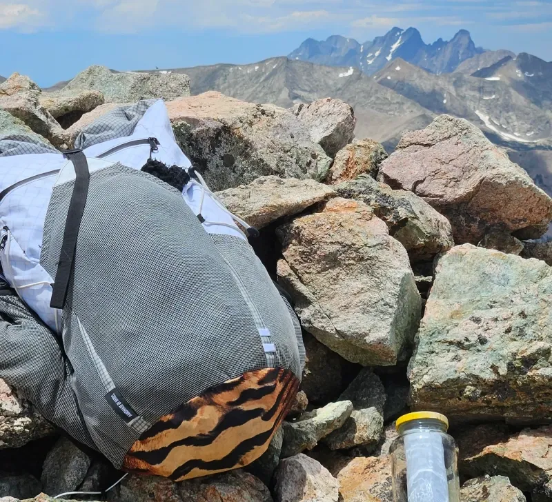 an ultralight custom backpack by exotic pack co based in chama new mexico sitting out in the wild on a mountain
