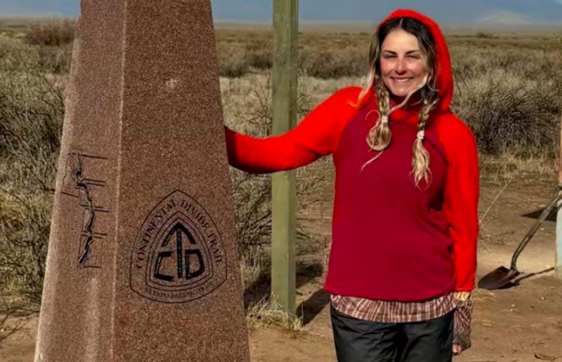 a woman thru-hiking the cdt wears a custom tumble on outfitter fleece hoodie made to her specifications