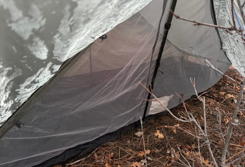 The One Tent By Gossamer Gear pitched in a very tight spot showing off its small size