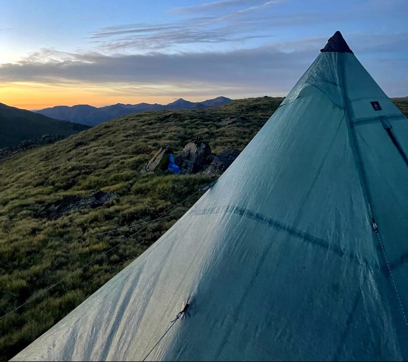 UltaMid 4 Ultralight Pyramid Tent By Hyperlite Mountain Gear at sunset on alpine tundra