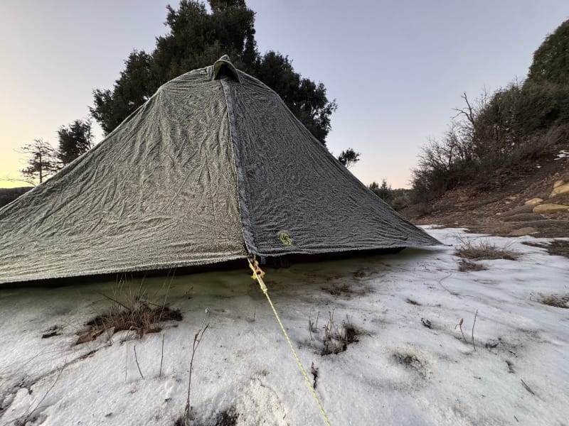 Lunar Duo Backpacking Tent By Six Moon Designs covered in a thick layer of ice on snowy ground
