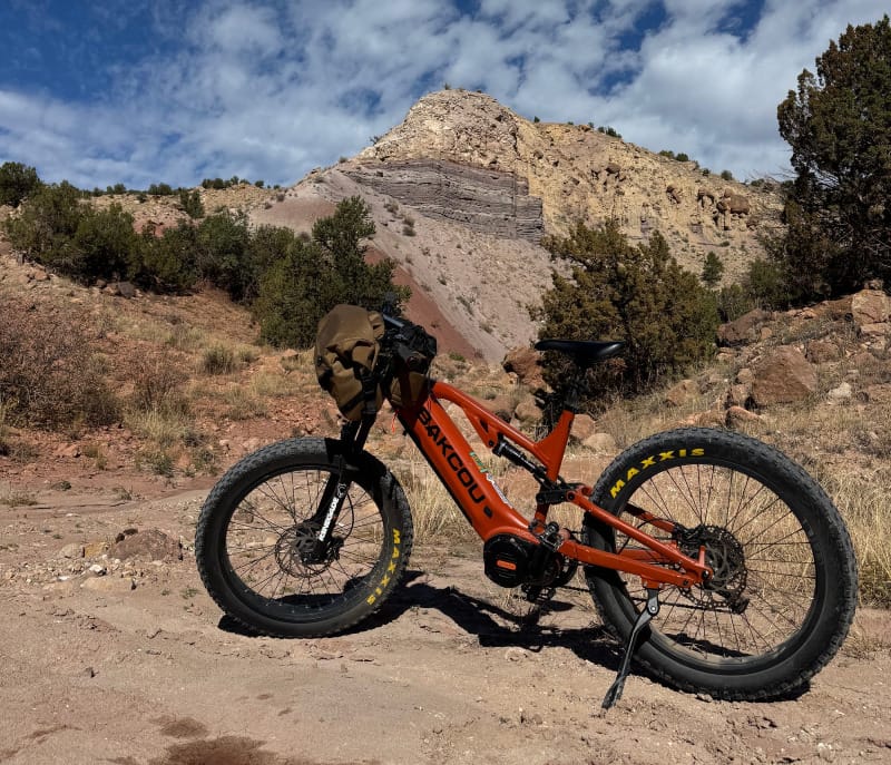 Scout Full Suspension eBike By Bakcou on slickrock in a southwest mountain setting heading to a trailhead