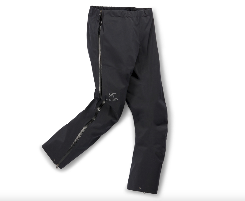 Arc'teryx Beta rain pants with full-length zippers, displayed folded and partially unzipped.