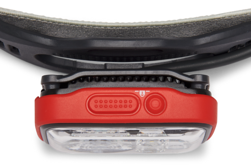 Close-up of the Black Diamond Distance 1500 headlamp's front unit showing buttons, LED bulbs, and part of the head strap.