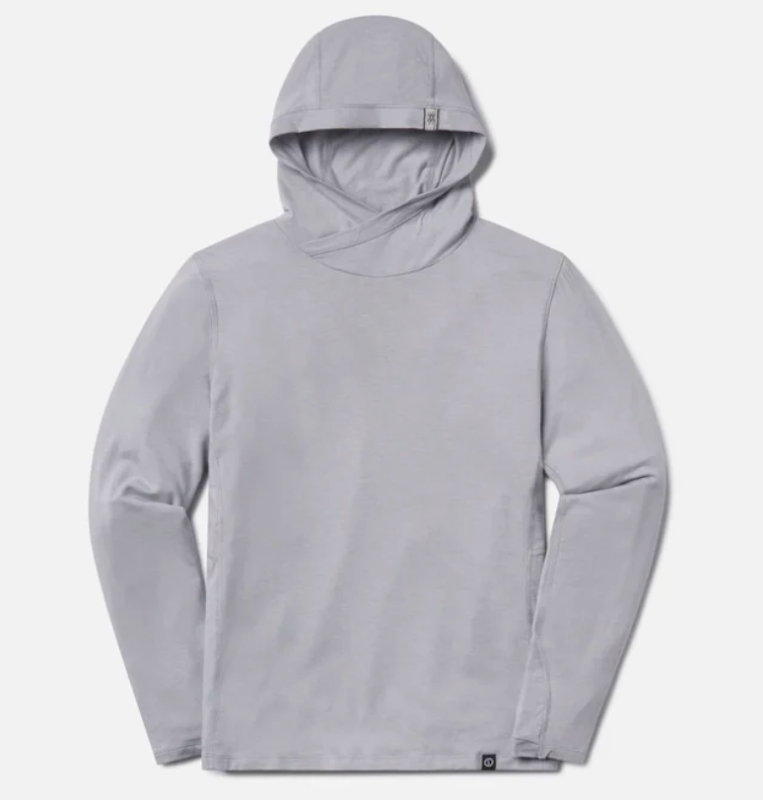 Flat lay of the PAKA Sol Hoodie in gray, showing the crossover hood design and soft, minimalist look.