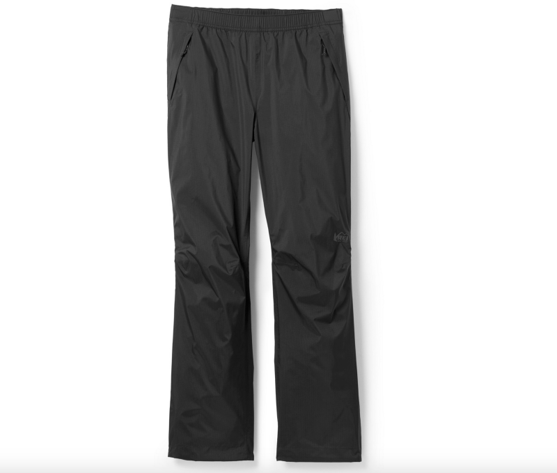REI Co-op Rainier rain pants for women in black, displayed flat against a white backdrop.