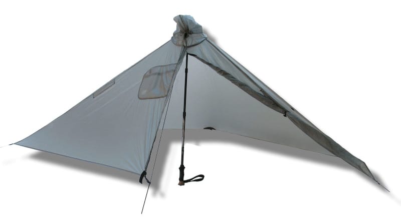 Ultralight Gatewood Cape shelter pitched with a single trekking pole, showcasing its poncho-style design and 360-degree weather protection.