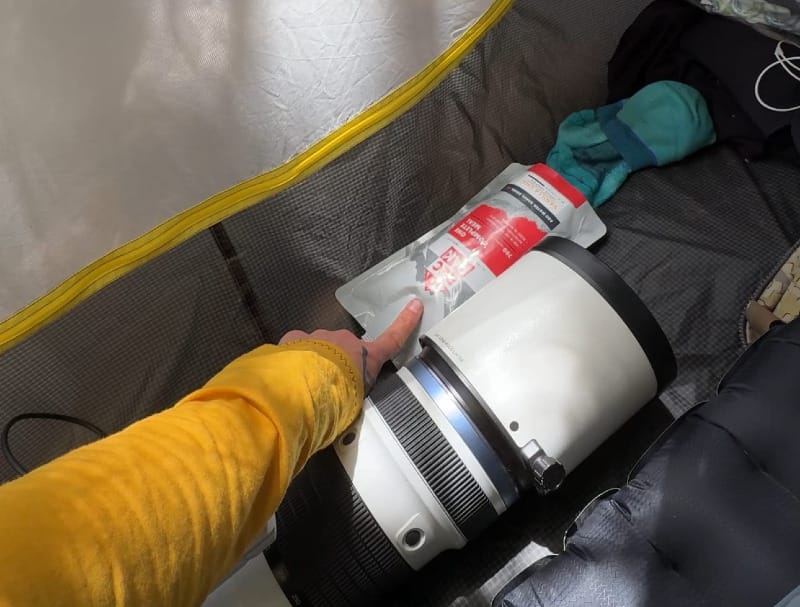 A recpak in a tent on a backpacking trip during rains when eating inside is important