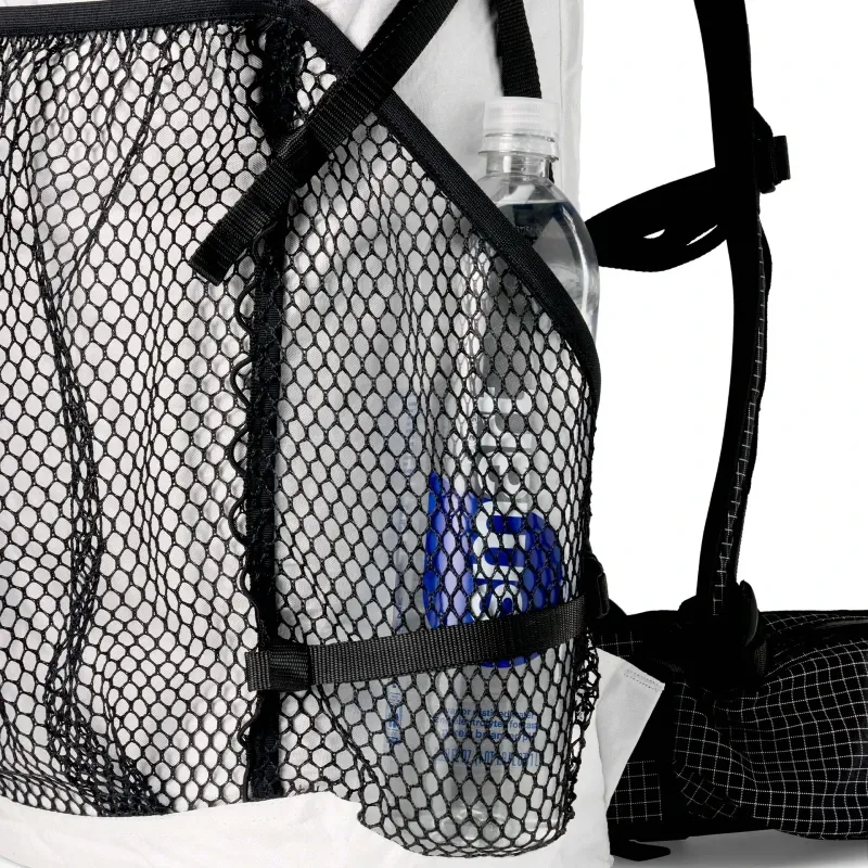 Close-up of the new side mesh pocket design on the Hyperlite Windrider 40 backpack holding a Smartwater bottle.