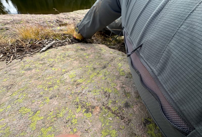 Close-up of KUIU Tiburon Pants showing zippered hip vent design for airflow and temperature regulation.