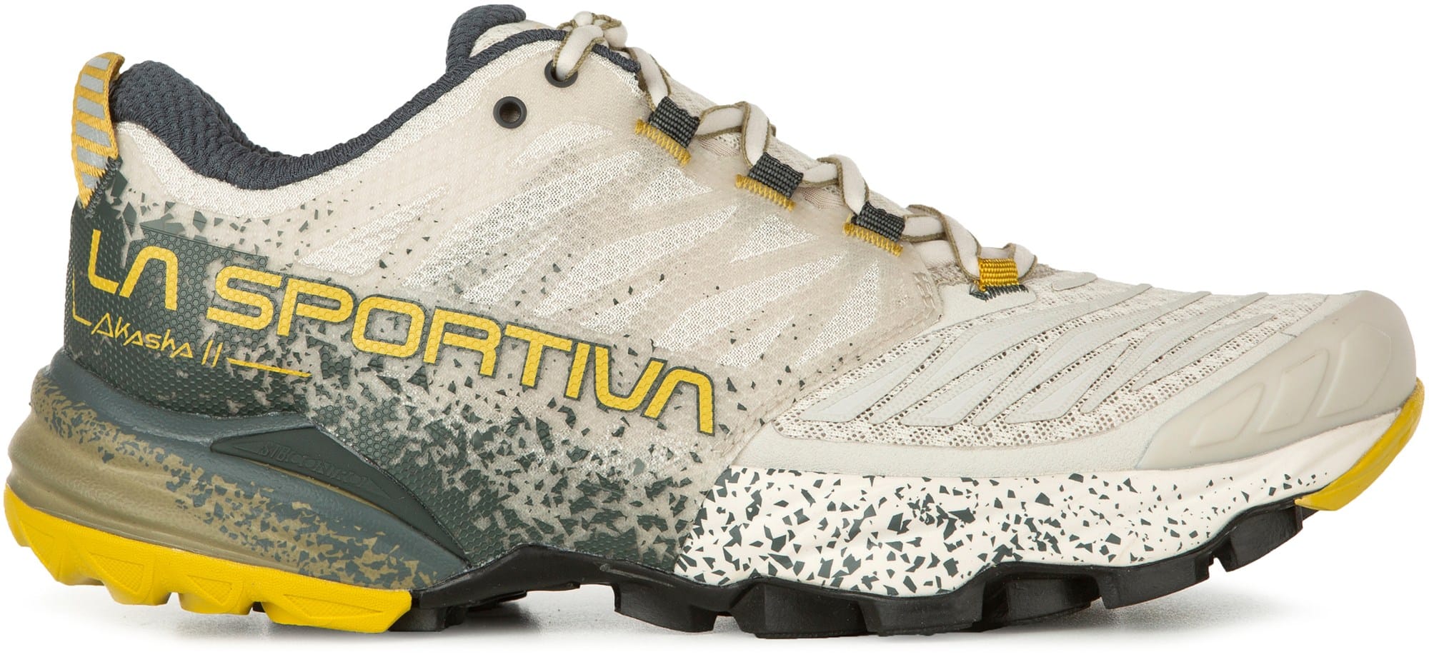 La Sportiva Akasha II trail runners on uneven ground, emphasizing outsole tread pattern for superior grip.