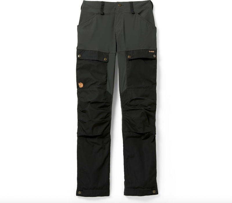 Black and gray Fjällräven trekking pants with reinforced knees and pockets, built for cold-weather hiking and fall camping.