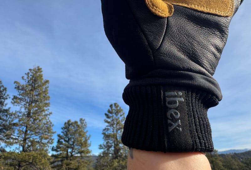 Ibex Kilometer Gloves merino wool cuff with Ibex logo designed for cold-weather hiking and active use