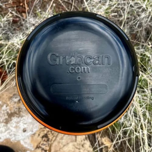 Top view of Grubcan Wave bear canister lid showing tool-free opening design for backpacking and bear country travel