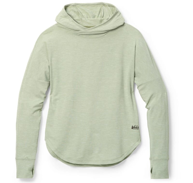 REI Co-op Sahara Shade Hoodie in light green, featuring a lightweight long-sleeve sun hoodie design with an integrated hood and thumb loops for hiking and backpacking.
