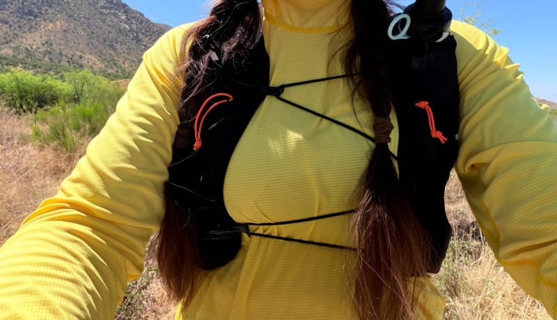 Close-up of the Hyperlite Mountain Gear Pemi 15 shoulder harness and hydration pocket system during a desert hike.