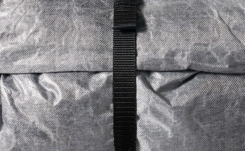 Close-up of the Hyperlite Mountain Gear Pemi 15 roll-top closure and Dyneema fabric texture.