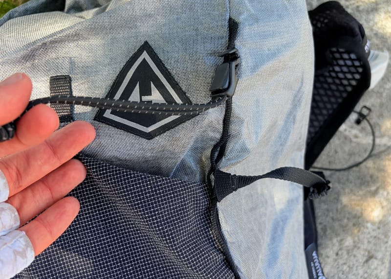 Top-down view of the Hyperlite Mountain Gear Pemi 15 showing mesh vest pockets, cord system, and accessible trail storage.