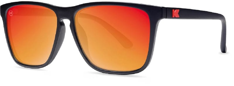 Knockaround Fast Lanes sunglasses with red mirrored lenses and black frame displayed on a white background.