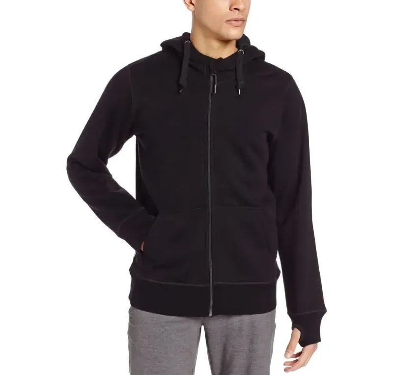 Model wearing a black Minus33 Kodiak heavyweight wool hoodie with a full-length zipper, drawstring hood, and front pockets.