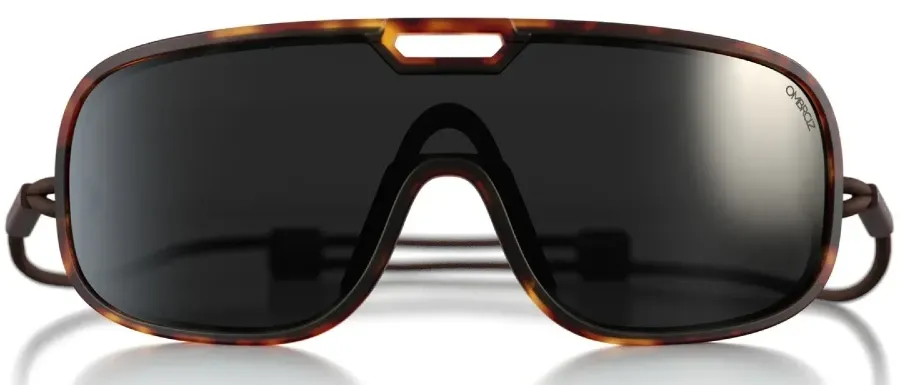Ombraz Refugio armless sunglasses with dark lenses, tortoiseshell-style frames, and an adjustable cord on a white background.