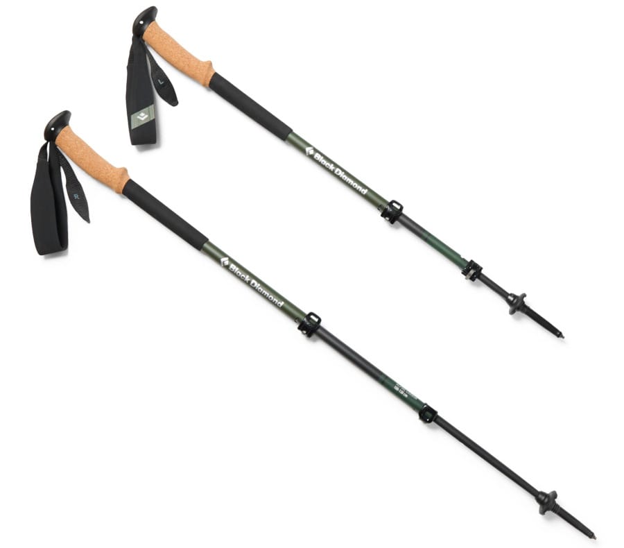 Pair of Black Diamond Alpine Carbon Cork trekking poles with green carbon shafts, natural cork handles, adjustable locks, and black wrist straps.