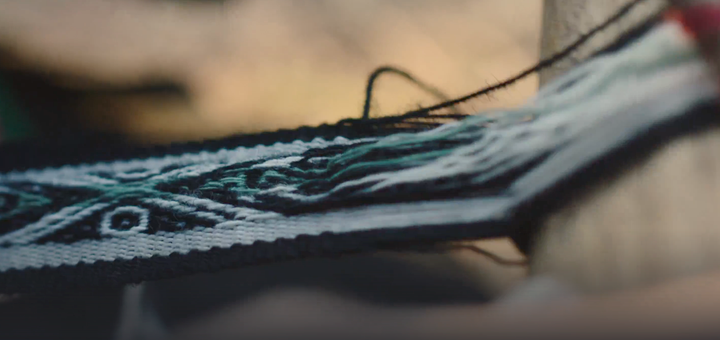 Close-up of hands sewing a PAKA alpaca wool sweater, highlighting artisan craftsmanship and sustainable materials during the 2025 Black Friday Cyber Mondaysale!