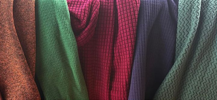 A close-up of the fabrics the best fleece hiking hoodies of 2025 are made of, showing off the variety of pattern and feel