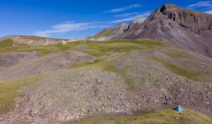 UltaMid 4 Ultralight Pyramid Tent By Hyperlite Mountain Gear pitched in a high alpine camo on a backpacking trip in the rocki
