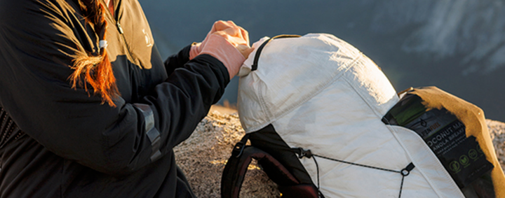 Outdoor Vitals CS40 Ultra Backpack sale banner of a woman using this backpack on a mountain