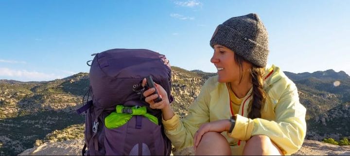 a backpacker check her Garmin inReach Mini 2 25% Off sale during march 2025