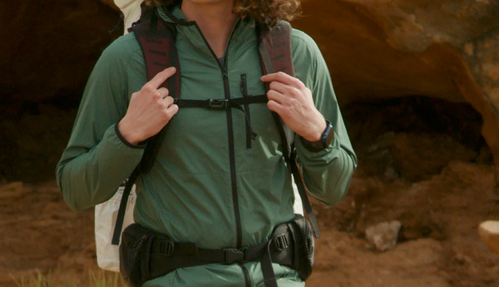 a hiker wears outdoor vitals nebo windbreaker on an adventure